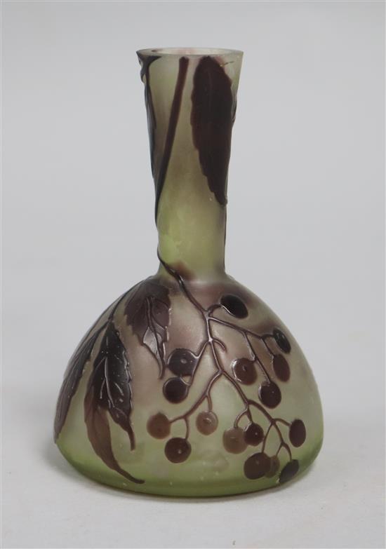 A Galle bottle-shaped cameo glass vase decorated with berries and leaves